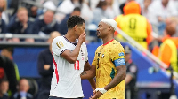 A picture of Bellingham covering his mouth while talking to Jordan Ayew has caused controversy