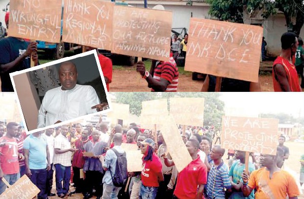 A section of the youth with their placards during a demonstration at Nyinahin [INSET] Ibrahim Mahama