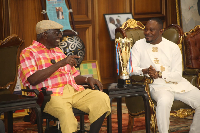 A photo of President Kufuor and Osei Mensah Joseph