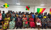 Participants of the training pose for a photo