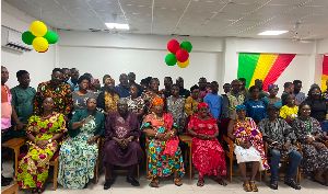 Participants of the training pose for a photo