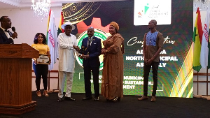 Alhaji Dr. Umar Babs Bodinga (middle) receiving his award