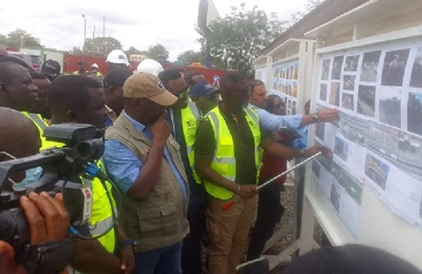 Mr. Bempong (right) briefing the minister and his entourage