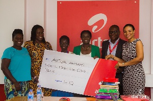 Afua Ansah (3rd from left) receiving the scholarship package from Airtel