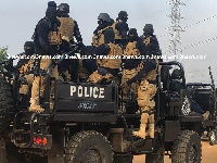 Armed police officers wearing masks at the Ayawaso West Wuogon by-election