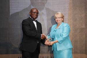 Director General of the Ghana Ports and Harbours Authority, Paul Asare Ansah (L) receiving an award