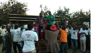 PNC National Chairman (in green)  addressing the electorate