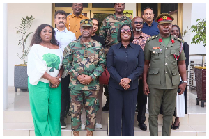 Obuobia Darko-Opoku (M) in a group photo with GAF, Defence Ministry, and DIHOC representatives