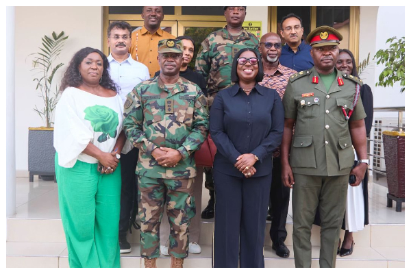 Obuobia Darko-Opoku (M) in a group photo with GAF, Defence Ministry, and DIHOC representatives