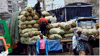 Potato traders wait for traders for the valuable commodity