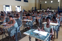 Some senior high school students writing their exams