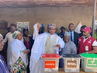 Buhari displays his vote after casting ballot in Daura