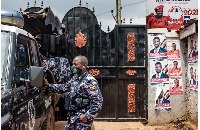 A police car outside the headquarters of the Uganda's opposition party National Unity Platform