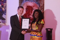 The British High Commissioner, Iain Walker, presenting the award to Abena Asomaning-Antwi