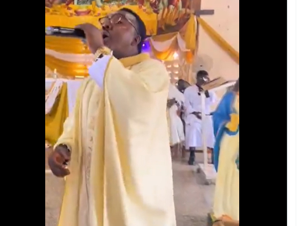 A Catholic priest singing