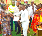 Patricia Nuamah (L) receiving her price for best farmer