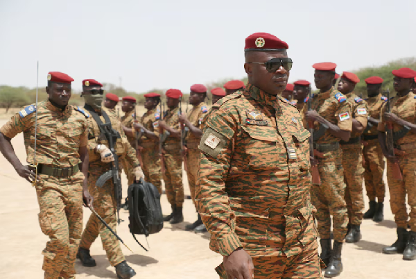 Burkina Faso President Lieutenant Colonel Paul-Henri Damiba is welcomed by soldiers in Dori