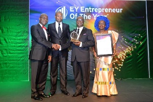 Dr Kwabena Adjei receives his award