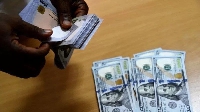 File photo of US dollar notes and Naira notes