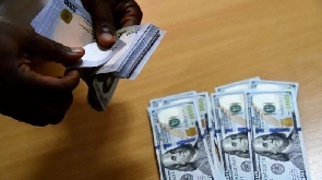 File photo of US dollar notes and Naira notes