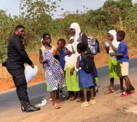 The policeman gave each of the children some water to drink
