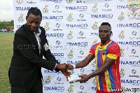 Patrick Razak receiving his NASCO Man of the Match award from the Match Commissioner.