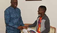 Vice President, K.B. Amissah-Arthur (left) presents laptop to Attah