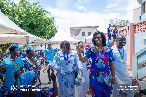 Alma Adade-Prempeh waving at some people