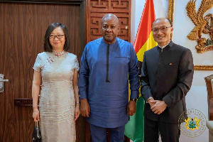 The outgoing Chinese Ambassador (R) with President John Mahama