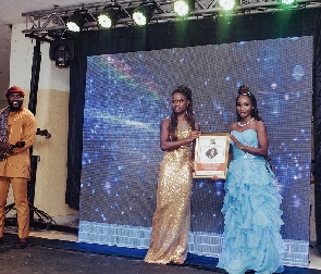 Zino Lexili Ogazi receiving the award