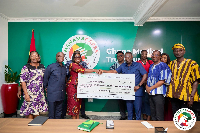 ADB delegation presenting a cheque to the Ghana Medical Trust Fund