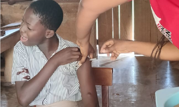 A girl seen receiving the HPV vacination