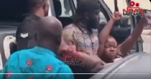 The suspect who collapsed in court being carried by police officers