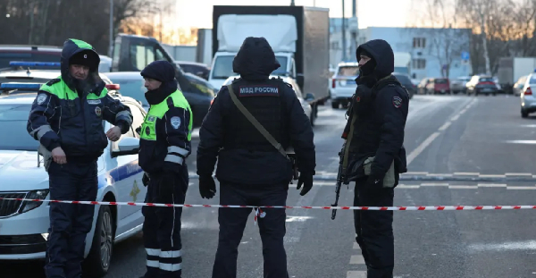 Police stand guard close to the scene of the explosion