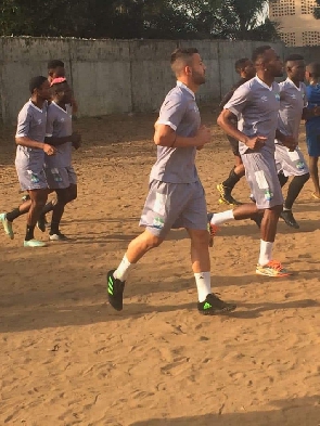 Sierra Leone's senior national team training on a grass-less pitch