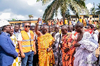 A chief pouring libation at the commissioning of the 6-unit classroom block