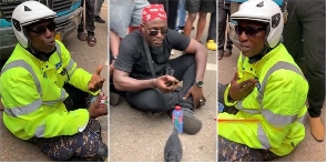 Police officer sitting on the floor begging protesters