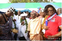 President Akufo-Addo holding a microphone with some members of the Ga traditional council