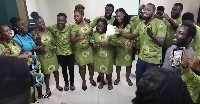 Some of the members of the choir dancing and singing