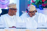 Nigerian business mogul Femi Otedola (R) and business magnate Aliko Dangote (L)