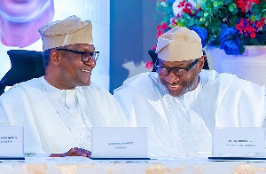 Nigerian business mogul Femi Otedola (R) and business magnate Aliko Dangote (L)