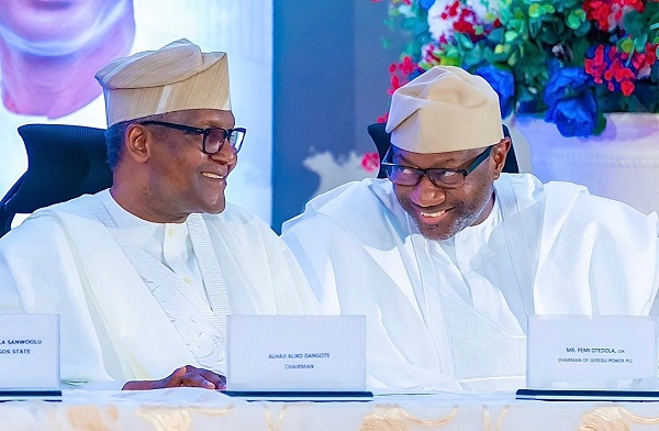 Nigerian business mogul Femi Otedola (R) and business magnate Aliko Dangote (L)
