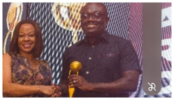 CEO of St. John’s Hospital and Fertility Centre, Dr. Maame Yaa Afriye (Left) receiving the award