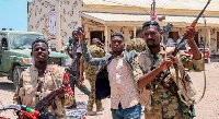 Sudanese army soldiers loyal to army chief Abdel Fattah al-Burhan pose for a picture