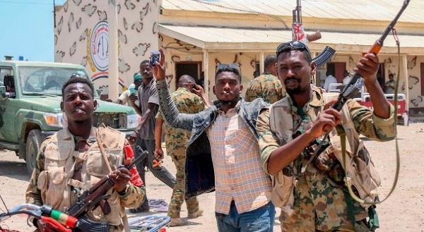 Sudanese army soldiers loyal to army chief Abdel Fattah al-Burhan pose for a picture