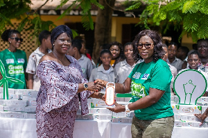 Shirley Tony Kum (right) presenting the solar lamps to Mad. Habibah Kotomah