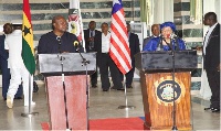 Former president  John Mahama (L) and President Ellen Johnson Sirleaf