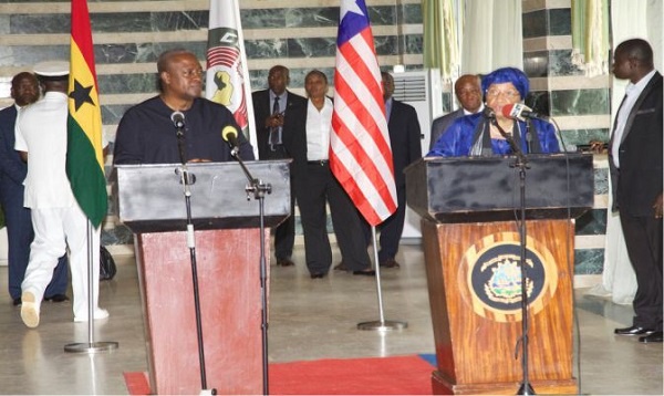 Former president  John Mahama (L) and President Ellen Johnson Sirleaf