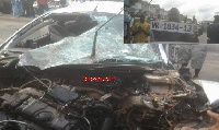 The severely damaged saloon car