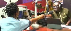 Bola Ray and COP Lydia Donkor in a handshake